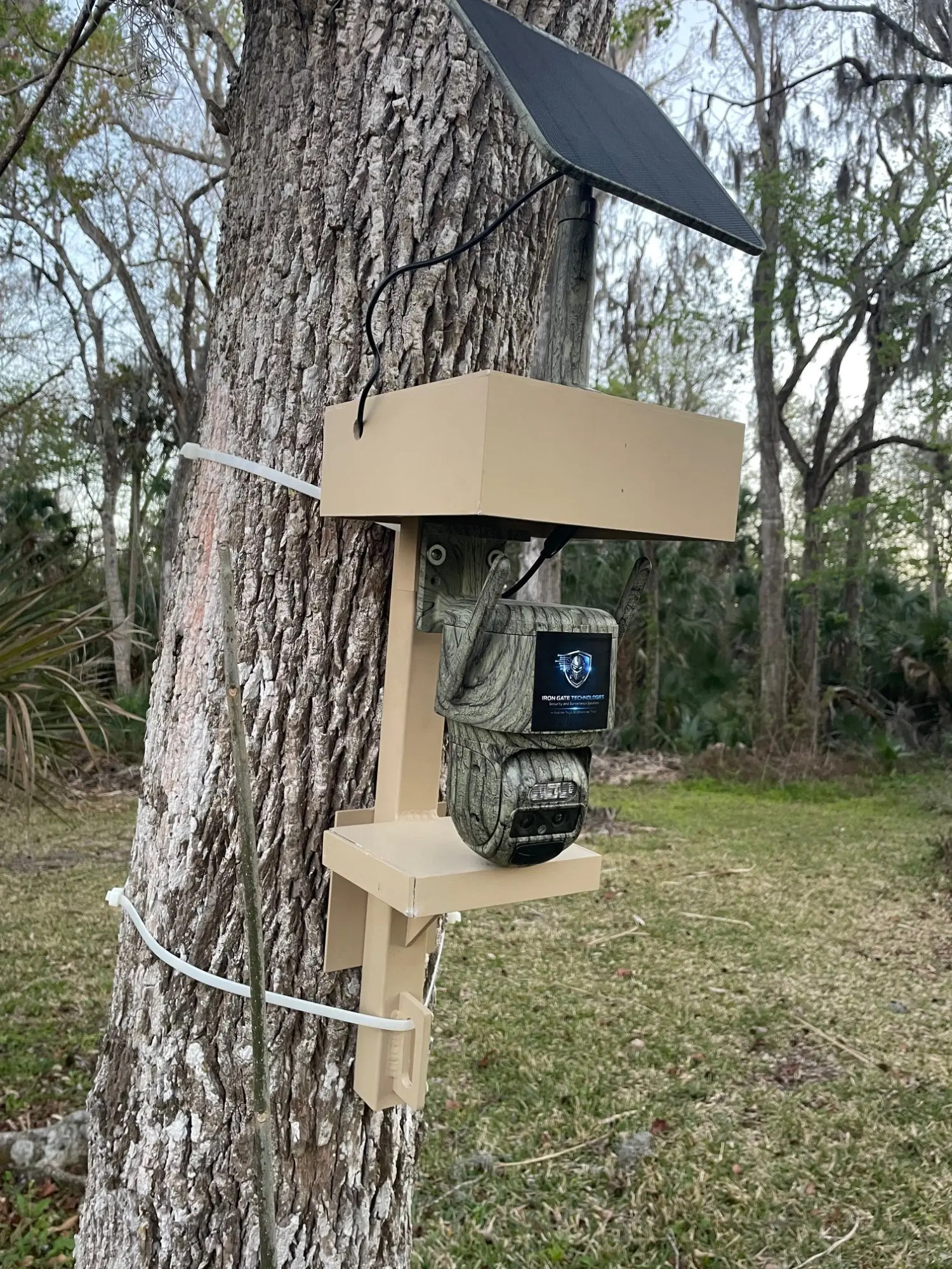 Hunting Solution camouflage PTZ camera with custom mounting bracket, close-up detail