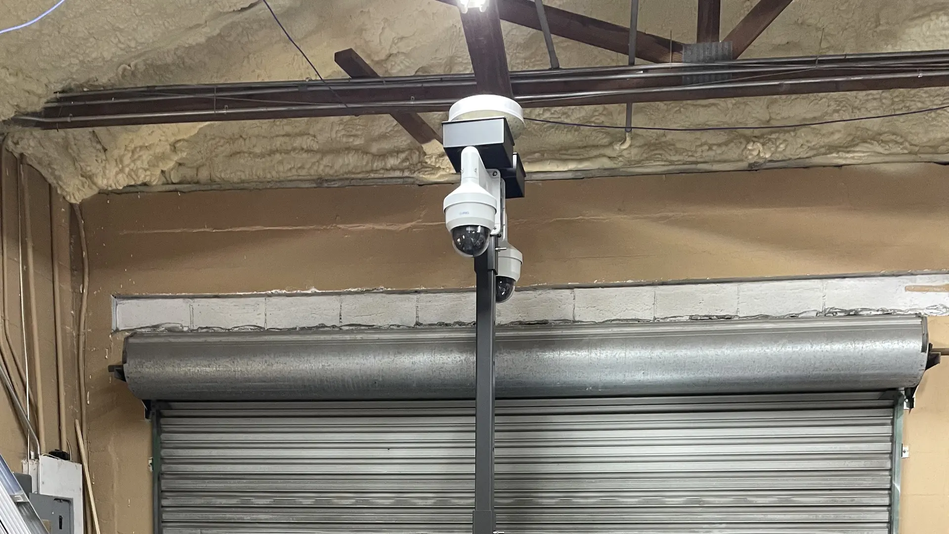 Iron Gate SecPod unit under assembly, mast-mounted i-PRO cameras at the Holly Hill facility